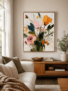 Colorful impasto floral painting above a neutral sofa in a contemporary living room