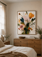Pink and orange abstract floral wall art displayed above a bed in a soft modern bedroom