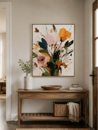 Abstract botanical wall art above an entryway console in an organic modern foyer