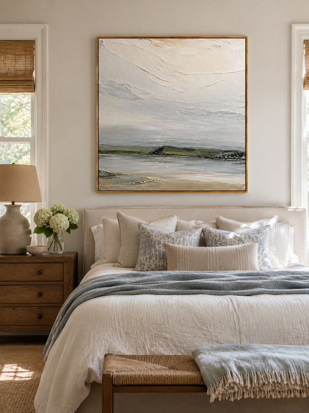 Minimalist sage green coastal wall art displayed above the bed in a calm neutral modern bedroom