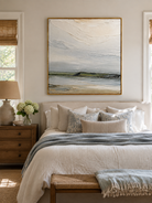 Minimalist sage green coastal wall art displayed above the bed in a calm neutral modern bedroom