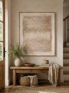 Wabi-Sabi beige textured abstract painting displayed above a wood console in an organic modern entryway