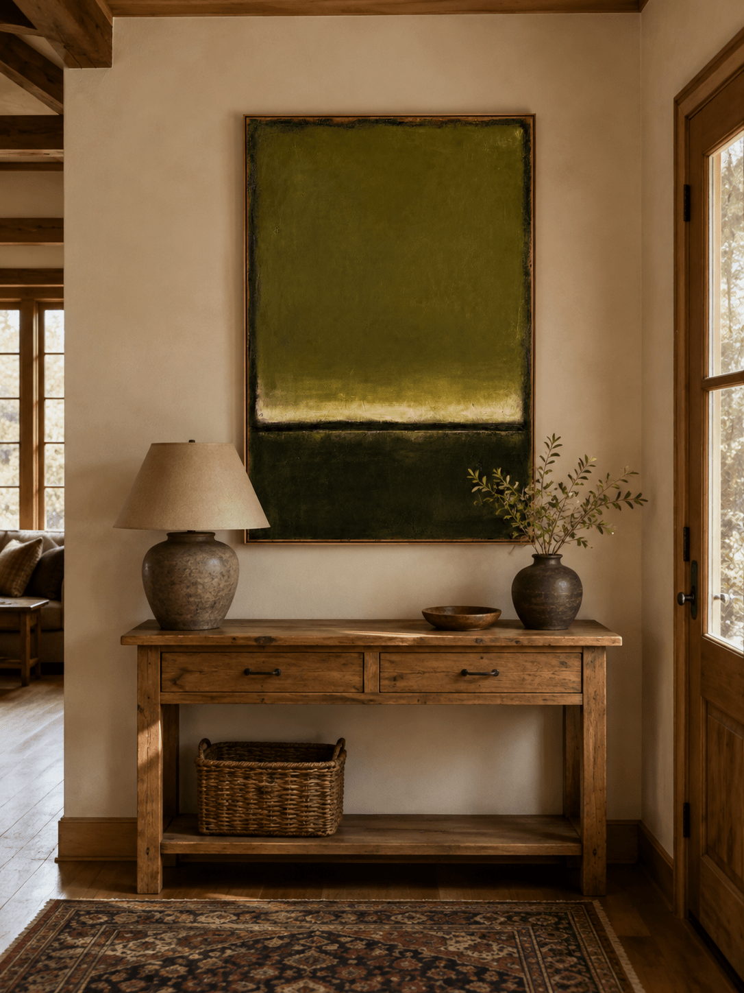 Vertical olive green color field painting displayed above a console in a modern entryway
