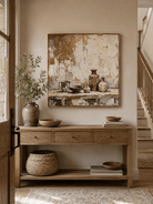 Wabi-Sabi pottery still life painting displayed above a wood console in a neutral modern entryway