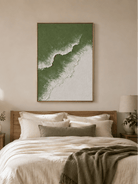 Minimalist sage green coastal wall art displayed above the bed in a calm neutral bedroom