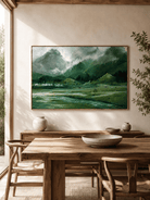Hand-painted green mountain valley landscape displayed in a dining room with natural wood furniture