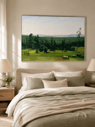 Peaceful green countryside wall art displayed above the bed in a nature-inspired bedroom