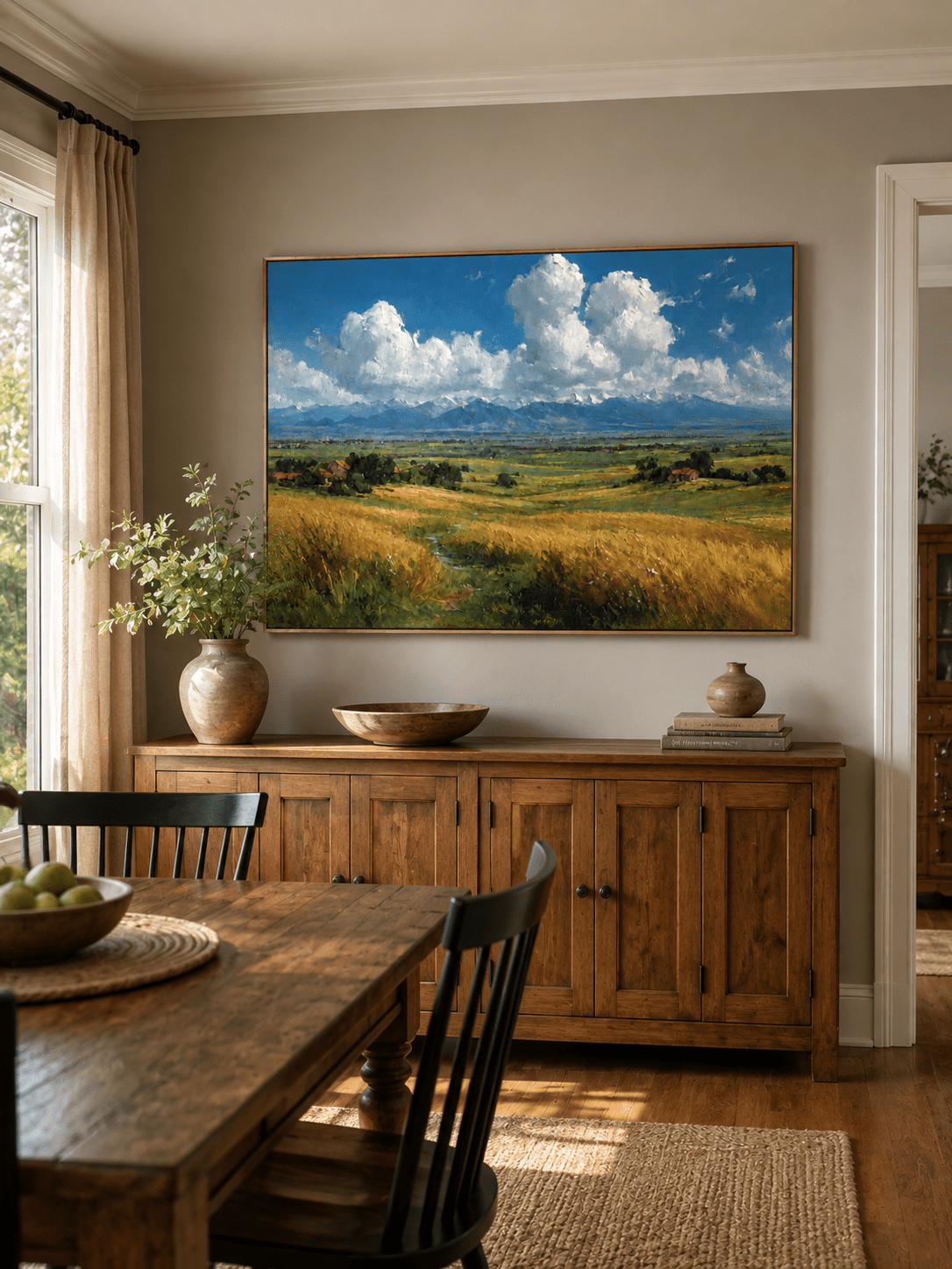 Hand-painted wheat field landscape displayed in a dining room with natural wood furniture