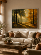 Golden autumn forest painting displayed above a neutral sofa in a warm organic modern living room