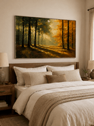 Sunlit fall forest wall art displayed above the bed in a warm neutral bedroom