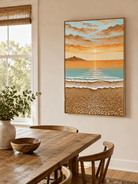 3D textured ocean sunrise painting styled in a warm open-plan dining room
