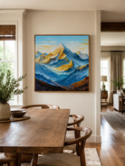 Textured blue and gold mountain landscape styled in a modern open-plan dining room