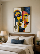 Colorful abstract portrait wall art displayed above a bed in a modern eclectic bedroom
