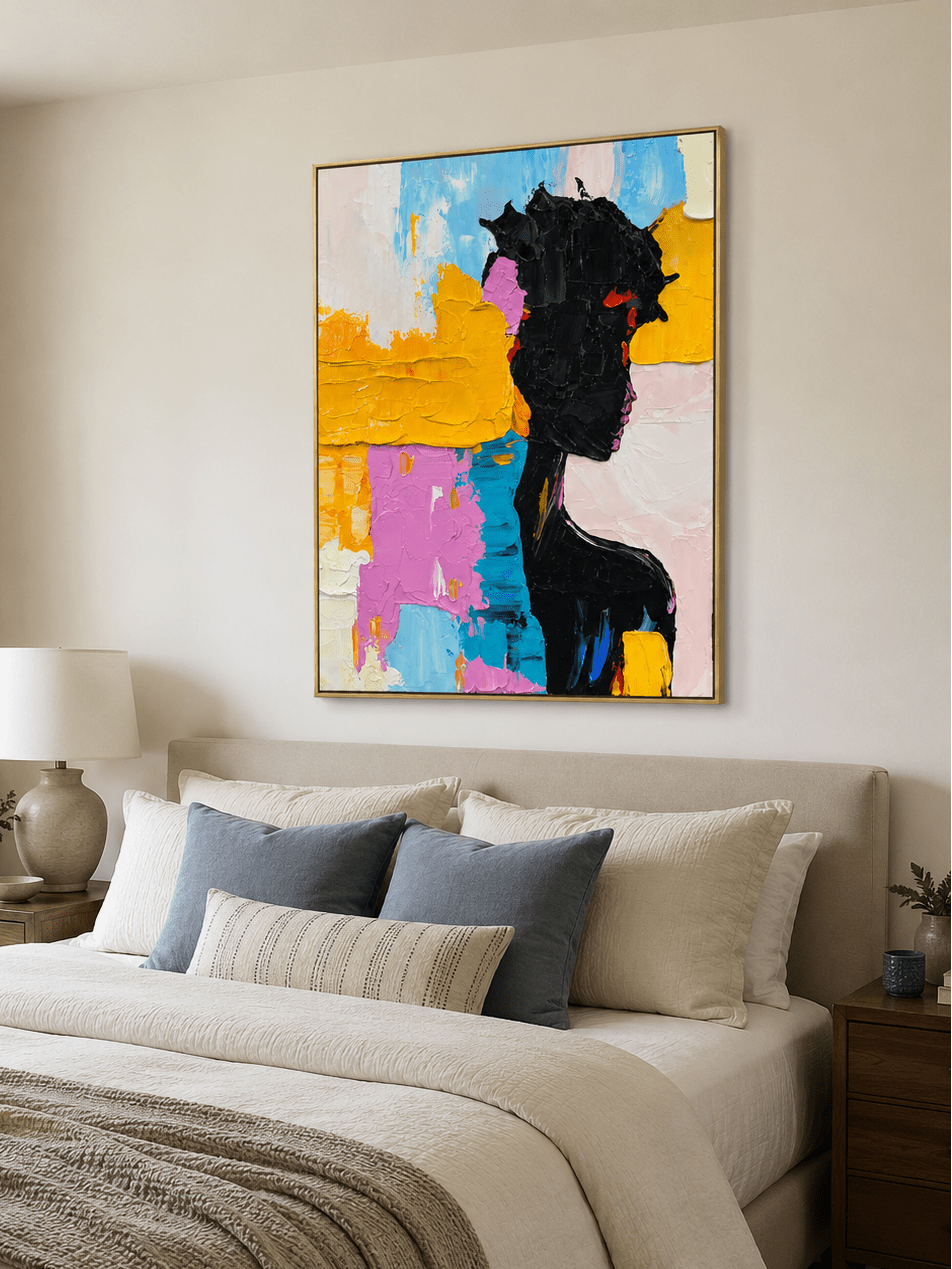 Textured female silhouette wall art displayed above a bed in a colorful contemporary bedroom
