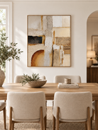 Hand-painted textured geometric abstract wall art displayed in a modern organic open-plan dining room