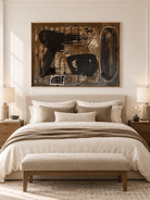 Moody earth-tone abstract painting displayed above a bed in a modern bedroom