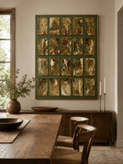 Large textured geometric wall art in olive green and gold displayed in an organic modern open dining room