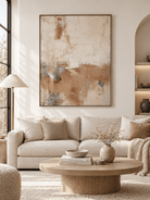 Large blush beige textured abstract wall art displayed above a sofa in a warm modern organic living room