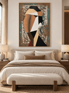 Cubist-inspired female portrait painting in warm earth tones displayed above a bed in a modern bedroom