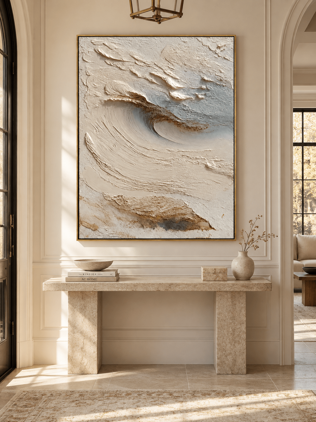 Vertical neutral abstract wave painting displayed above a console in a contemporary minimalist entryway
