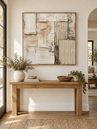 Square neutral textured abstract wall art displayed above an entryway console in a Japandi-inspired interior