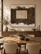 Large brown geometric relief wall art displayed in an organic modern open dining room with walnut furniture