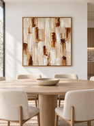 Large earth tone textured geometric wall art displayed in an open dining room with walnut and stone furniture