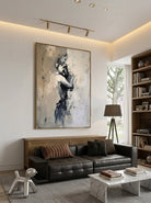Hand-painted abstract figurative canvas painting featuring a solitary female figure in neutral beige, gray, and black tones with expressive textured brushstrokes for modern bedroom wall decor.