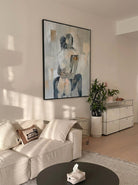Hand-painted abstract romantic couple canvas painting featuring a seated embrace in neutral beige, gray, ivory, and black tones with textured contemporary brushstrokes.