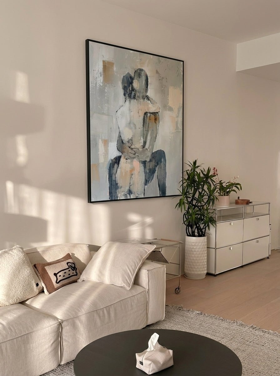 Hand-painted abstract romantic couple canvas painting featuring a seated embrace in neutral beige, gray, ivory, and black tones with textured contemporary brushstrokes.