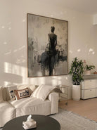 Heavy texture hand-painted abstract ballerina canvas painting in warm gray, cream, and charcoal black by Eleanor Hayes for organic modernist wall decor.