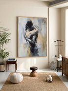 Hand-painted abstract figurative painting of an embracing couple in neutral beige, gray, and black tones with expressive textured brushstrokes for modern bedroom wall decor.