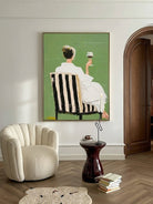Hand painted modern feminine figurative wall art with woman holding wine glass on green background for contemporary bedroom decor