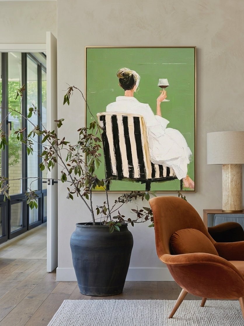 Hand painted modern feminine figurative wall art with woman holding wine glass on green background for contemporary bedroom decor