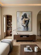 Hand-painted abstract romantic couple painting featuring two embracing figures in neutral beige, gray, black, and ivory tones with textured contemporary brushstrokes on canvas.