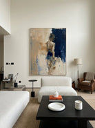 Heavy texture hand-painted abstract female figure painting in navy blue and oatmeal beige by Eleanor Hayes for modern interior wall decor.