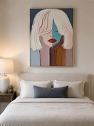 Pastel abstract woman wall art displayed above a bed in a soft modern bedroom