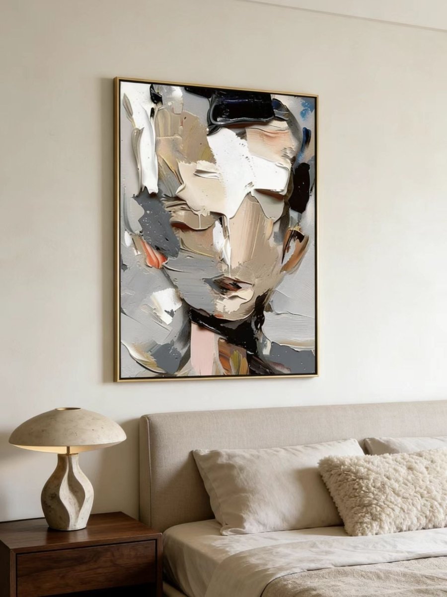 A high-definition close-up of a hand-painted abstract portrait , showing extremely thick impasto paint texture in grey, cream, and orange.