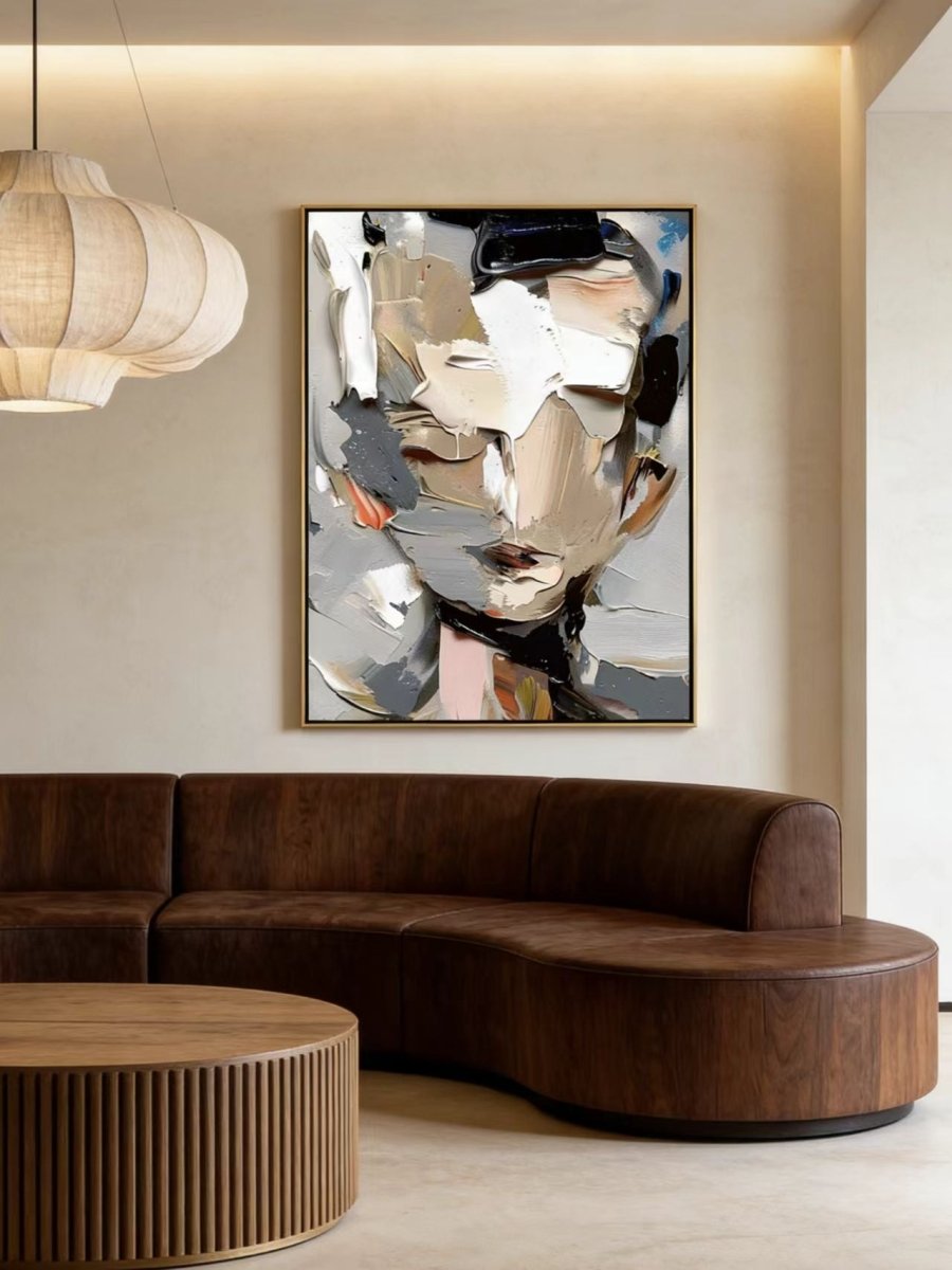 A high-definition close-up of a hand-painted abstract portrait , showing extremely thick impasto paint texture in grey, cream, and orange.