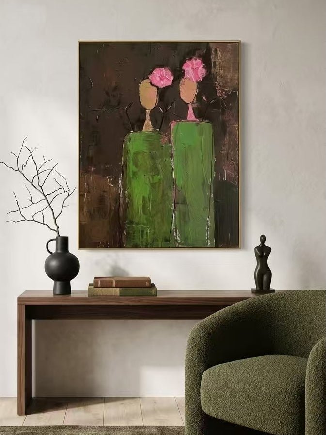 A vertical hand-painted 3D textured art of two women in green dresses with pink impasto flowers on their heads by Eleanor Hayes.