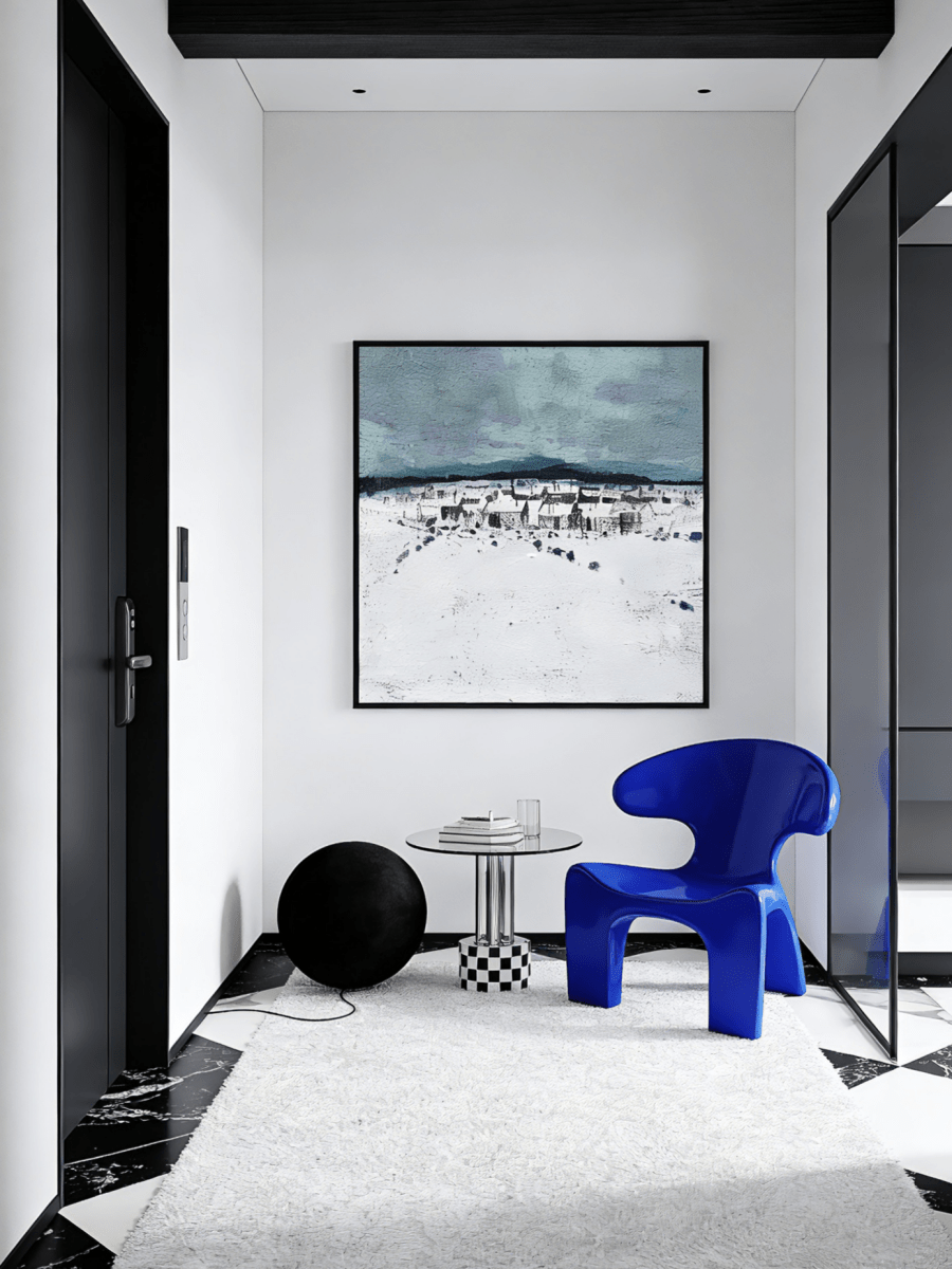 Hand-painted modern oil painting of a snowy village landscape with blue mountains and heavy white textured snow on canvas.