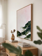 Large hand-painted modern abstract canvas painting with 3D heavy palette knife texture featuring a blush pink sky and forest green mountain range by Evelyn Li for bedroom wall decor.