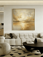 Large square hand-painted abstract seascape in gold and cream tones with shimmering water reflections by Evelyn Li in a high-end master bedroom.