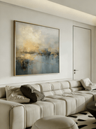 Large square hand-painted impressionist painting of a golden sun reflecting on a blue sea with heavy impasto texture by Evelyn Li in a modern living room.