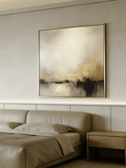 Large square hand-painted abstract painting with heavy 3D gold texture and black drip effect by Evelyn Li in a modern minimalist living room.