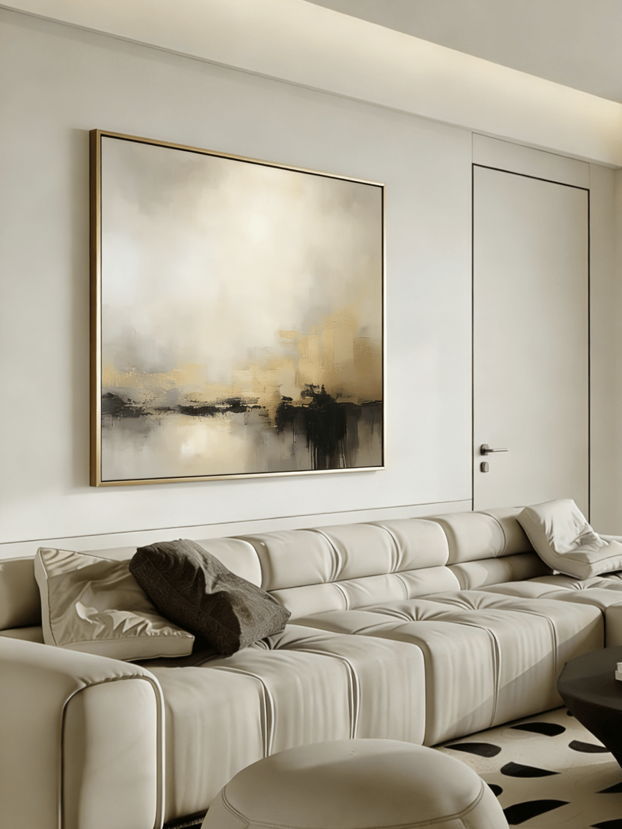 Large square hand-painted abstract painting with heavy 3D gold texture and black drip effect by Evelyn Li in a modern minimalist living room.