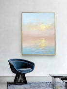Large vertical hand-painted impressionist sunset seascape in pastel pink and blue with golden light reflections by Evelyn Li in a minimalist bedroom.