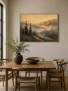 Hand-painted foggy mountain forest landscape displayed in a dining room with natural wood furniture