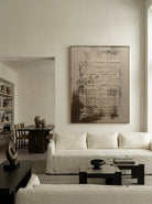 Large hand-painted modern abstract canvas painting with 3D plaster geometric grid texture in cement grey and rust brown by Eliot Vermeer for modern living room.