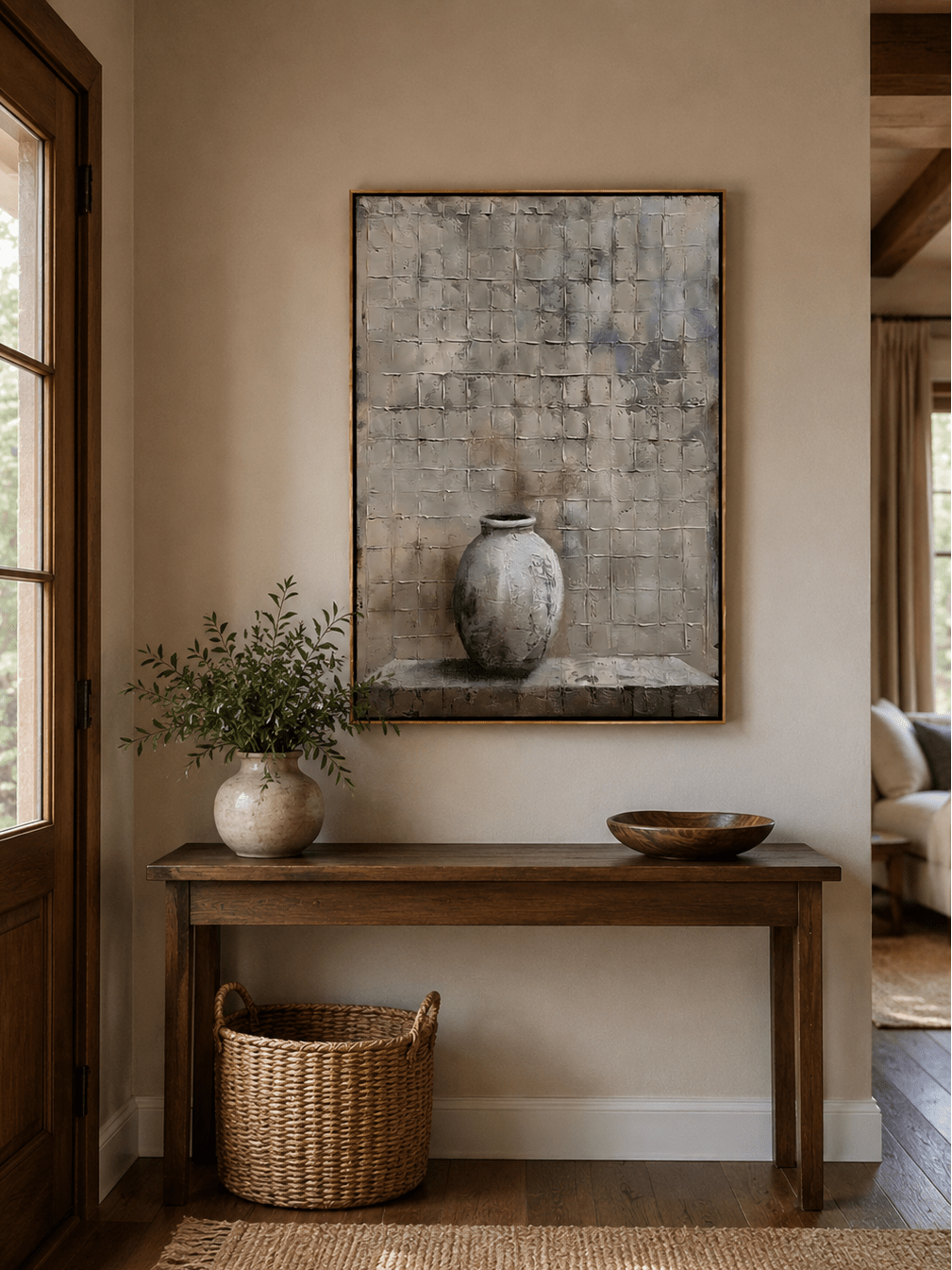 Wabi-sabi vase wall art above an entryway console in a neutral organic modern foyer